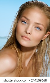 Closeup Of Woman With Wet Hair On Beach.