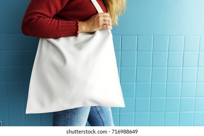 Closeup Of Woman With White Tote Bag