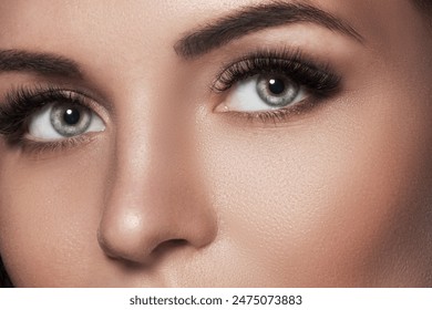 Close-Up of a woman's eyes after eyelash extension and eyebrow correction.