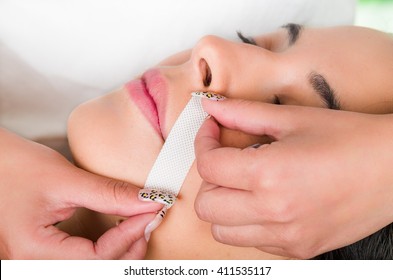 Closeup Womans Face Receiving Facial Hair Wax Treatment, Beauty And Fashion Concept