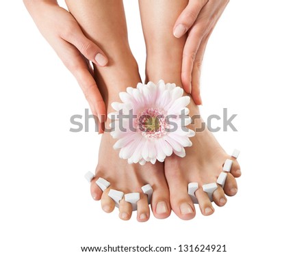 Close-up Of Woman's Feet Getting Pedicure Treatment