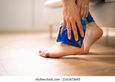 Close-up Of A Woman's Hand Applying Ice Gel Pack On Her Ankle - Powered by Shutterstock