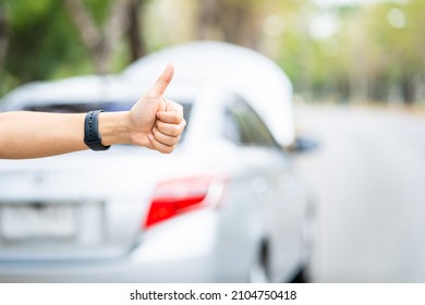 Close-up of woman's hand, Asian young woman opened the hood broken car on the road Searching for help The car is coming. - Powered by Shutterstock