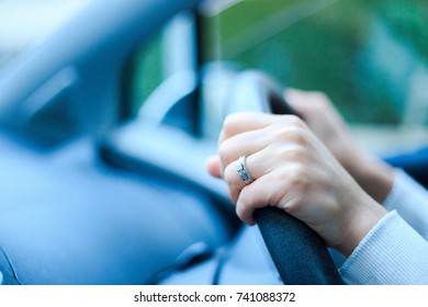 Close-up of a woman's hand holding a car handle - Shutterstock ID 741088372
