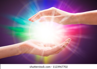 Close-up Of A Woman's Hand Holding Light Against Colorful Background - Shutterstock ID 1123967702
