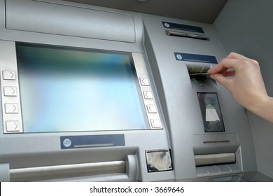 Closeup of woman's hand inserting e-card into ATM slot - Shutterstock ID 3669646