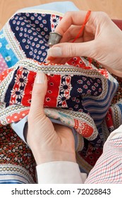 Close-up Of Woman's Hand Stitching Quilting