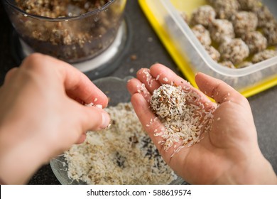 Closeup Of Woman's Hands Making Healthy Sweet Treats. Cooking Chocolate Protein Balls With Nuts And Peanut Butter. Healthy Lifestyle.