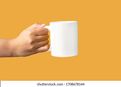 Closeup Of Women Hand Holding White Ceramic A Mug Mockup Isolated On Yellow