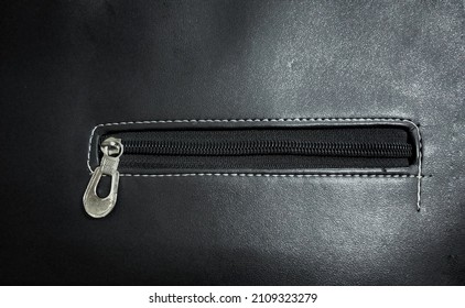 Close-up Of Women's Leather Handbag Zip Fastener Or Zipper Lock Isolated.