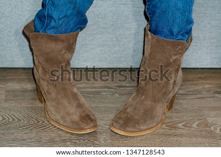 close-up. Women's suede boots. Women's brown shoes.  Female  footwear