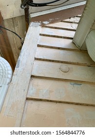 Closeup Of Wood Filler Being Used On Old Wood Siding Before Painting