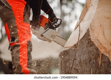 Close-up Of Woodcutter Lumberjack Is Man Chainsaw Tree.