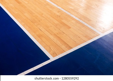 Close-up Wooden Basketball, Volleyball, Badminton Court Background. Sports Hall With Colorful Marking Lines. Old School, University Gym With Marking Lines Line. Indoor Sports Playground