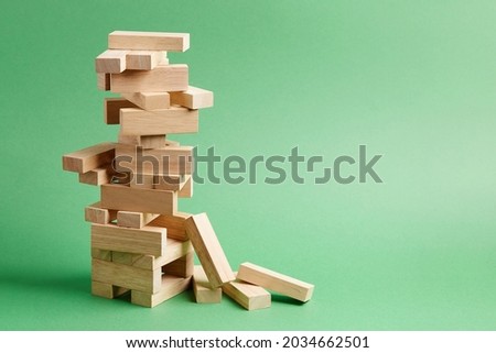 Close-up of wooden blocks game jenga fallen tower