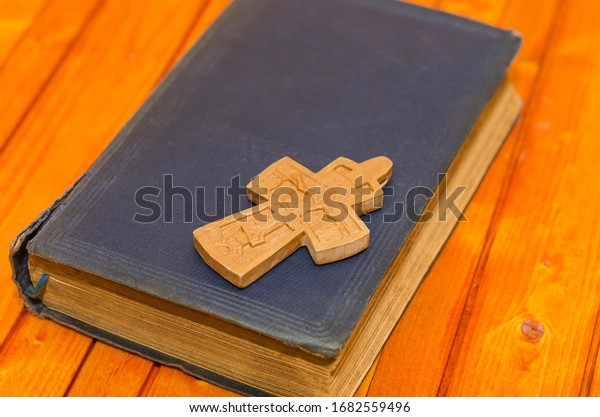 closeup-wooden-christian-cross-next-bible-stock-photo-1682559496