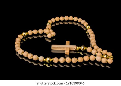 Closeup Of Wooden Christian Cross  Prayer Rosery  Beads On Black