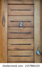 A Closeup Of A Wooden Door With Number 2