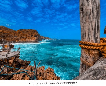 close-up of a wooden pole tied with a thick rope against a vibrant ocean background - Powered by Shutterstock