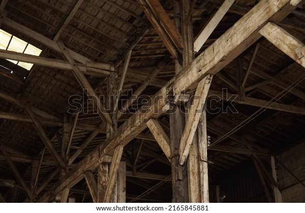 Closeup to a wooden structure of an ancient car\
cellar in Bordeaux