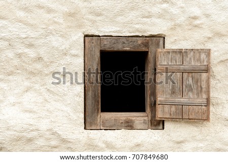 Closeup of a wooden window of an old farming house in Austria