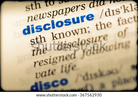 Close-up of word in English dictionary. Disclosure, definition and transcription