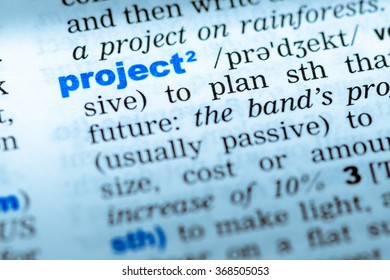 Close-up Of Word In English Dictionary. Project, Definition And Transcription