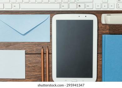 Close-up of work tools well arranged on wooden desk
