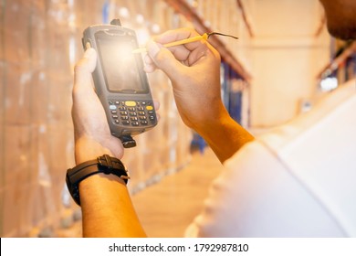 Close-up Worker Touching On Screen Barcode Scanner. Computer Equipment For Warehouse Inventory Management.