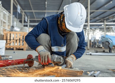 Close-up of a worker using an angle grinder to cut metal, with bright orange sparks flying, showcasing precision in metalworking.
