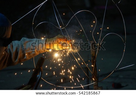 Closeup Worker welding sculpture art