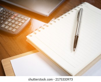 Closeup workspace on table,Pen with diary and laptop,calculator on workspace
