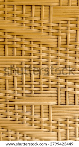 Close-up of woven wicker rattan pattern with crisscross design.