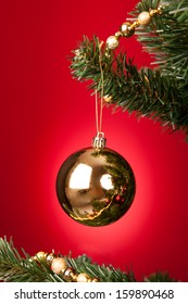 Close-up Of Yellow Decorative Bauble Hanged On Christmas Tree