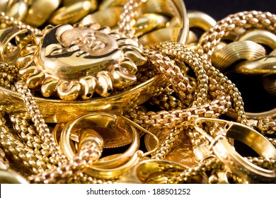 Closeup Of Yellow Gold Jewelery On A Black Background 