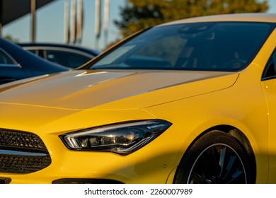 A closeup of yellow Mercedes Benz Kla car headlight