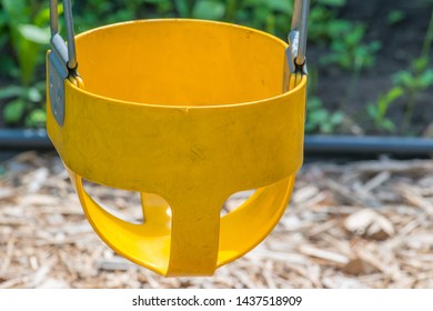 Closeup Of Yellow Toddler Baby Swing Part Of A Childrens Swing Set