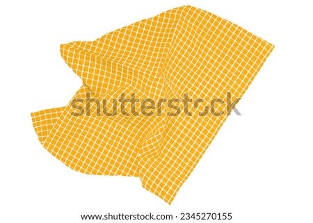 Closeup of a yellow and white checkered napkin or tablecloth texture isolated on white background. Kitchen accessories.