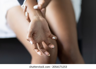 Closeup Of Young African Black Woman Hand Holding Wrist With Pain, Concept Of Sick Black Woman Patient Suffering From CTS, Wrist Pain, Trigger Finger