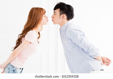 closeup young asian couple kissing