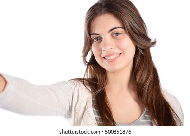 Close-up of young beautiful woman taking selfie. Isolated white background - Shutterstock ID 500851876