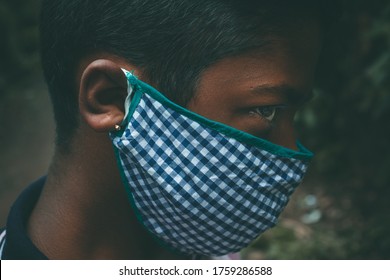 Closeup Of Young Boy Wearing Homemade Mask