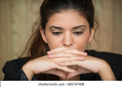 Close-up Of Young Businesswoman In Deep Thought