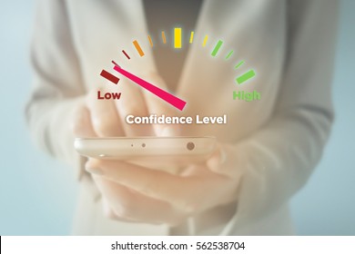 Close-up Of Young Businesswoman Using Smartphone With Low Confidence Level Meter