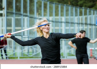 closeup of a young girl athlete javelin thrower tries in javelin. competitions at stadium - Powered by Shutterstock