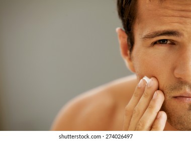 Close-up Of Young Man Applying Shaving Cream