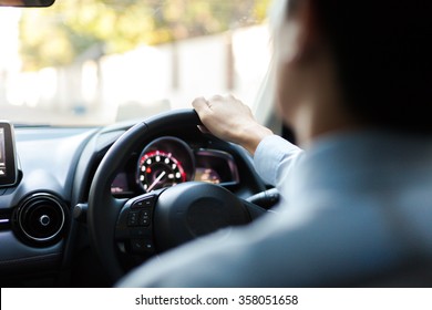 Close-up of Young man driving on the road