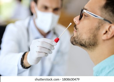 Close-up of young man getting PCR test at doctor's office during coronavirus epidemic.  - Shutterstock ID 1808630479