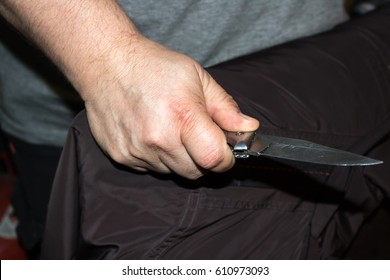 Closeup Of A Young Man Hand, Holding A Knife, About To Attack, 