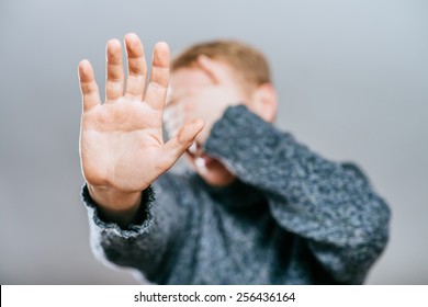 Closeup Of Young Man Hiding Face Whit Hands